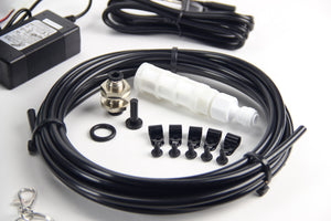 Close up of Mistking tubing and related components from the starter kit on a white background