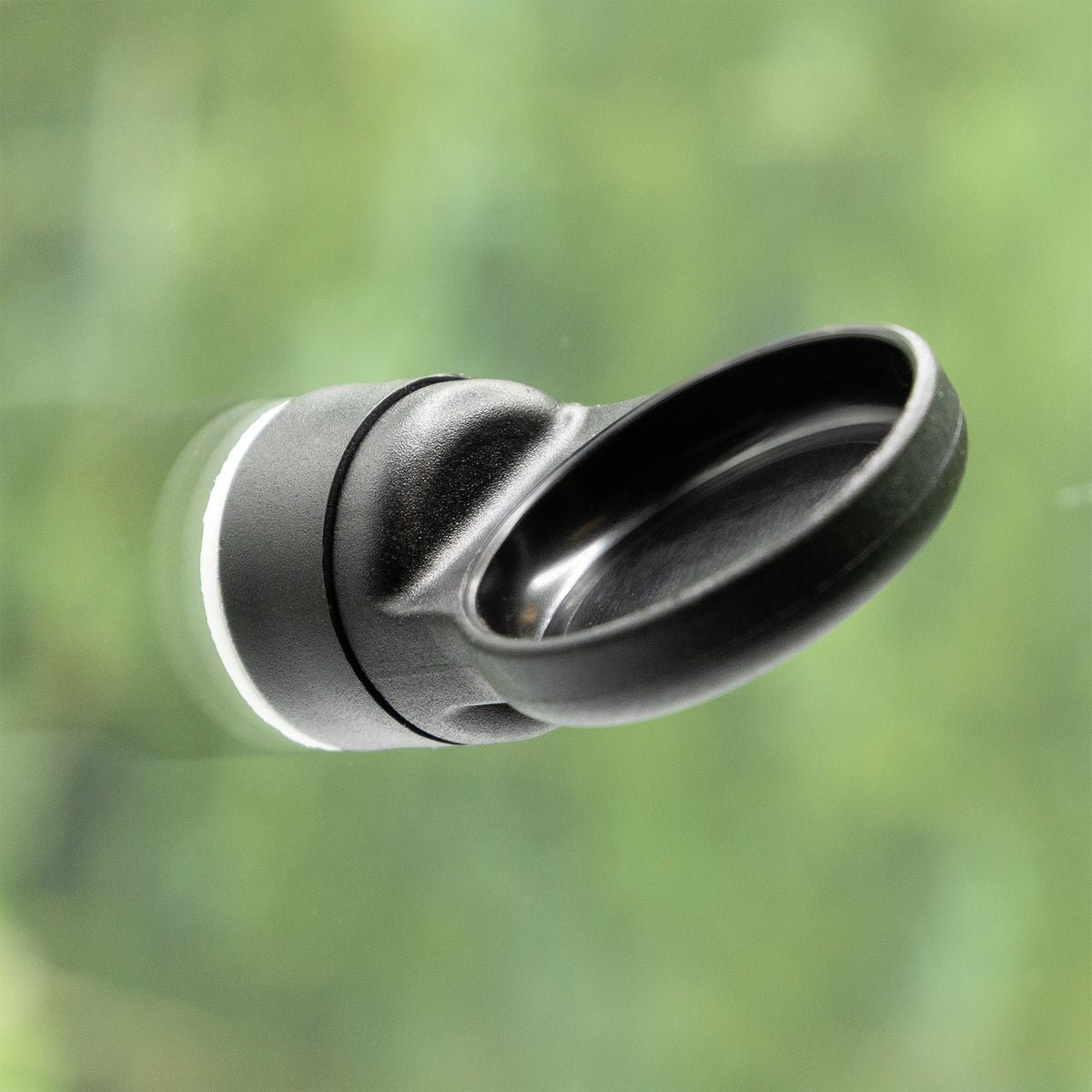 Pangea MicroDish Surface Mount Kit - mounted to glass surface with green background.