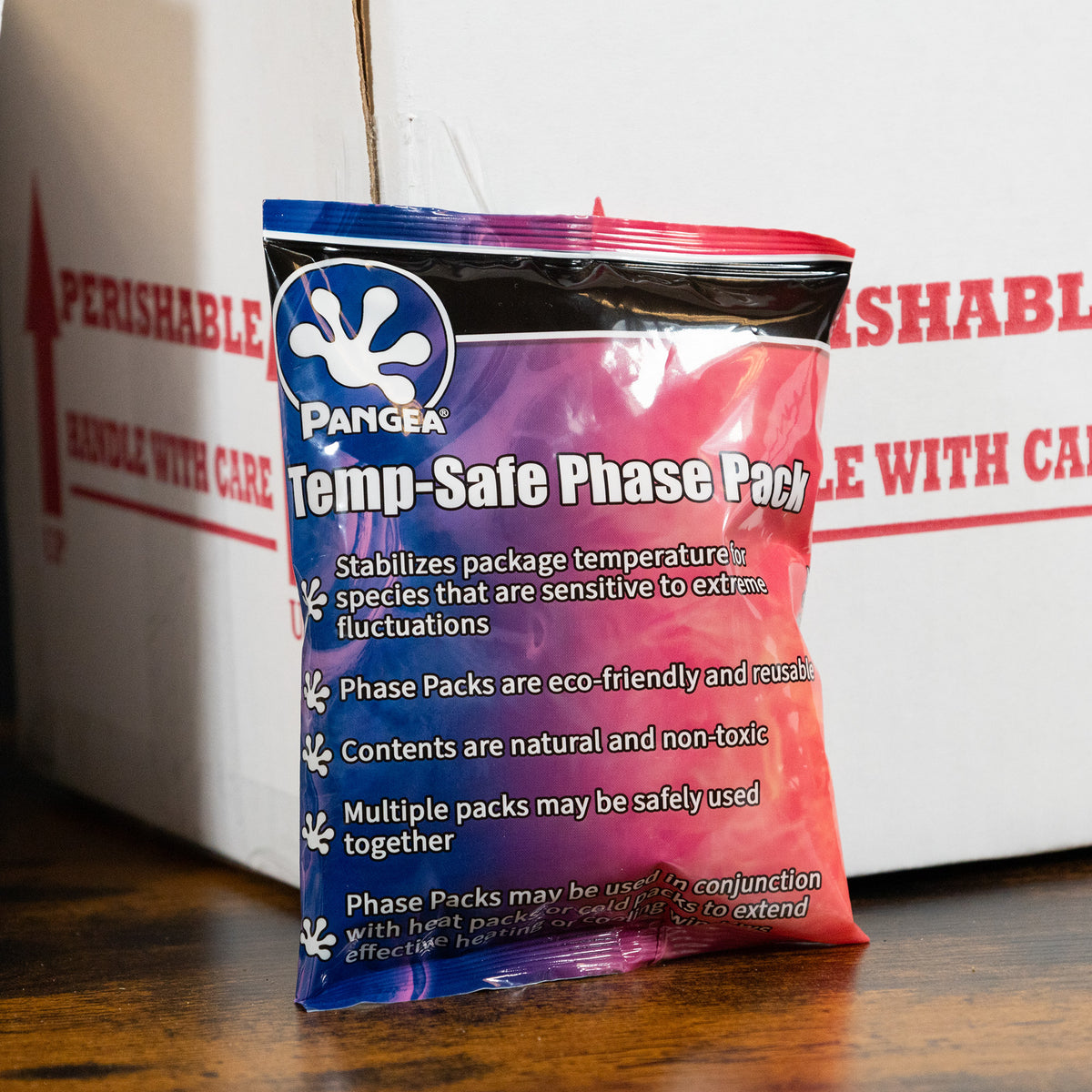 Pangea Temp-Safe Phase Pack - phase pack in front of shipping box.