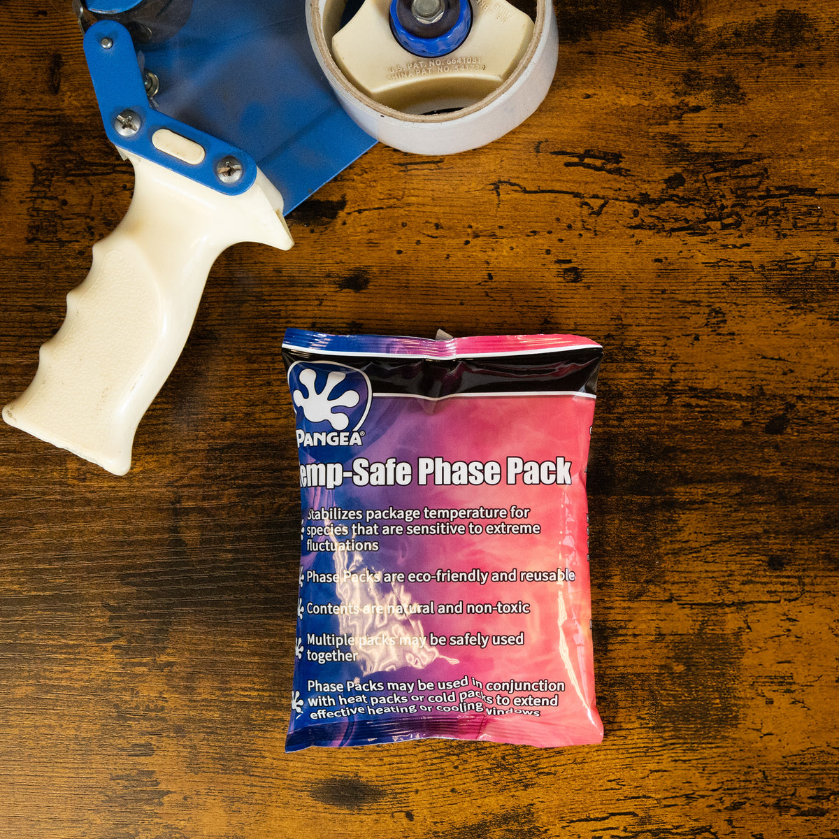 Pangea Temp-Safe Phase Pack - front on wood table next to tape gun.