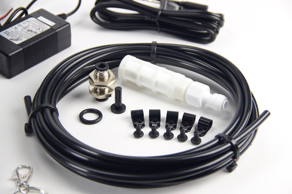 Close up of Mistking tubing and related components from the starter kit on a white background